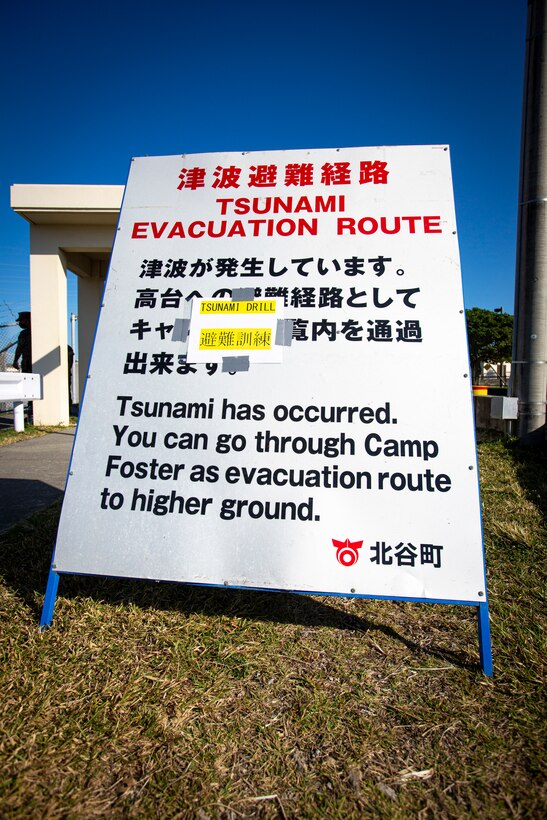 A sign is displayed to provide information to U.S. service members and local community residents as they participate in a tsunami evacuation drill on Camp Foster, Okinawa, Japan, Nov. 3, 2021. The drill was held to convey the readiness and capabilities of the camp to service members and local communities in the event of an emergency. (U.S. Marine Corps photo by Cpl. Karis Mattingly)