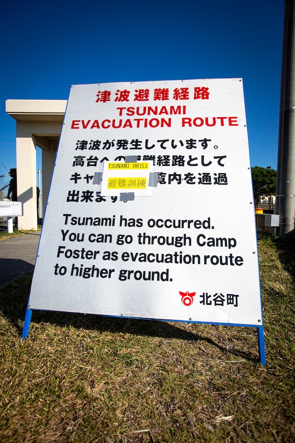 A sign is displayed to provide information to U.S. service members and local community residents as they participate in a tsunami evacuation drill on Camp Foster, Okinawa, Japan, Nov. 3, 2021. The drill was held to convey the readiness and capabilities of the camp to service members and local communities in the event of an emergency. (U.S. Marine Corps photo by Cpl. Karis Mattingly)