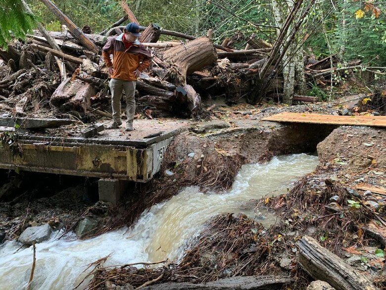 Photo showing rivers cleared of debris and logs above a bridge in Skagit County to improve access and mitigate against creek bank erosion.
