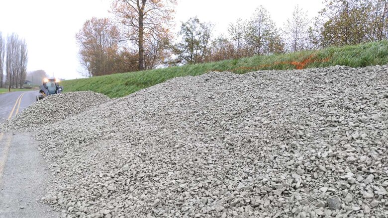 Photo of seepage berm material being spread along the landward side of the levee to help minimize seepage issues.