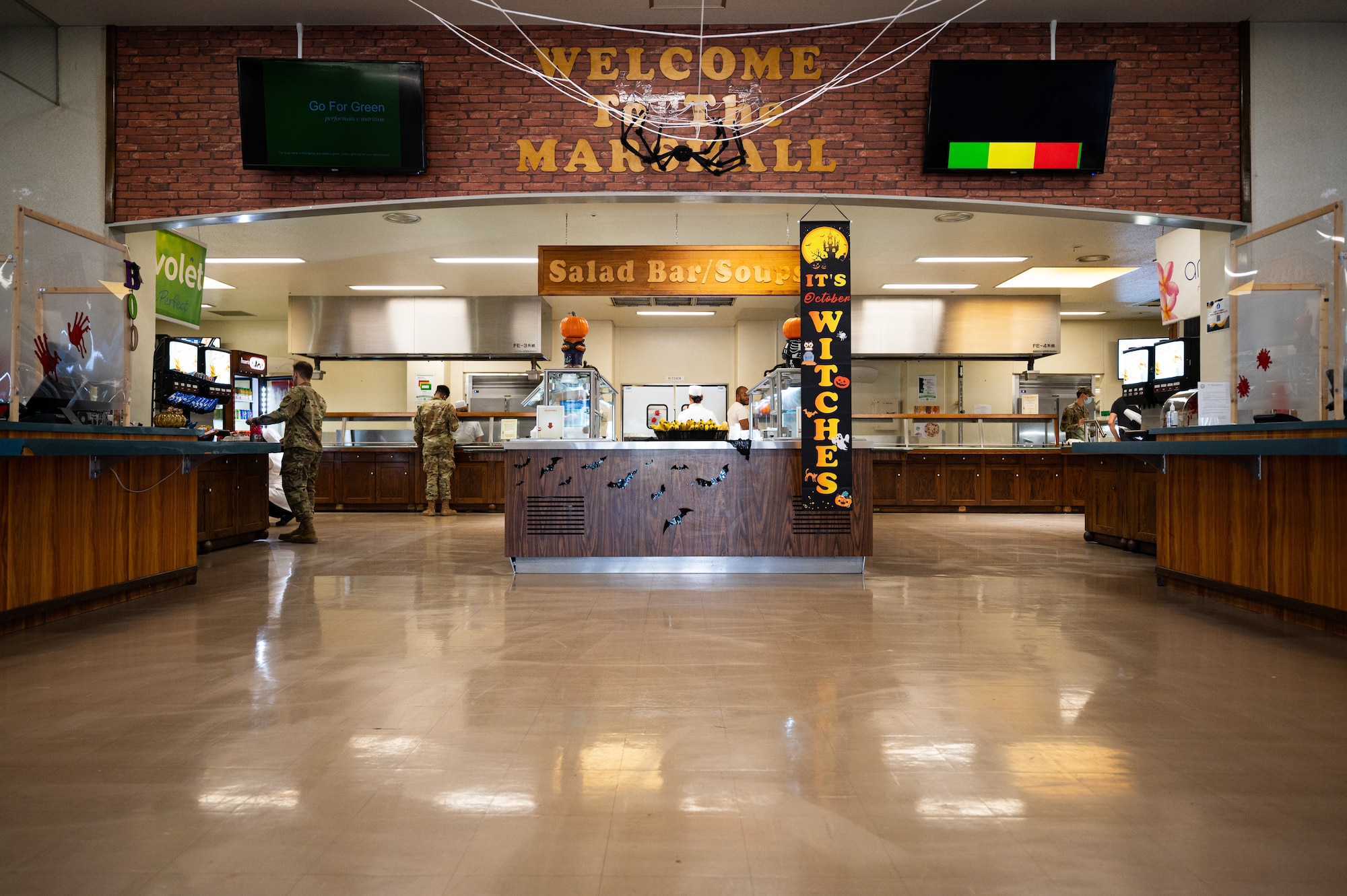 Airmen get food at dining facility.