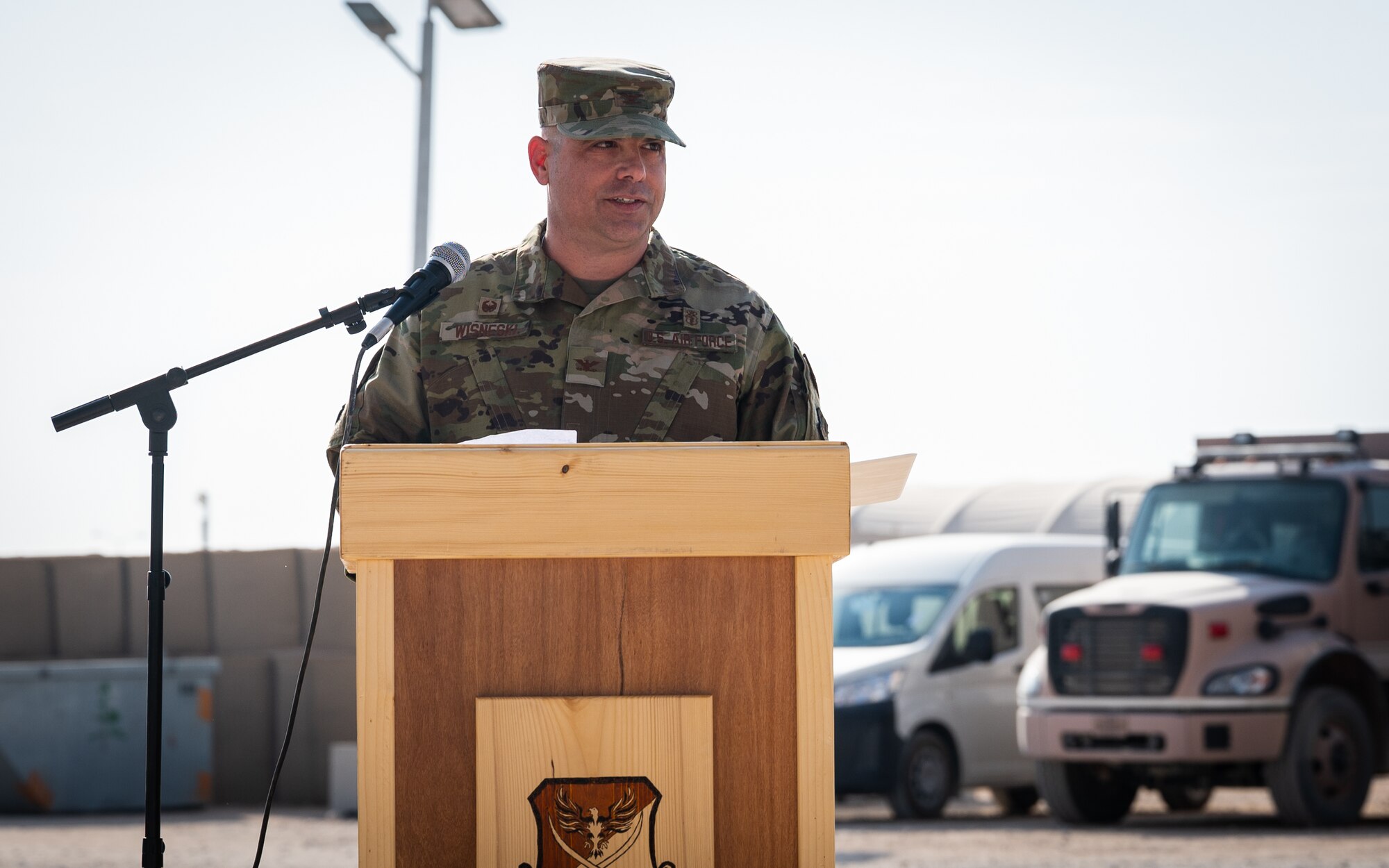 Col. Jeffrey Wisneski, incoming 378th Expeditionary Medical Group commander, makes remarks during the 378th EMDG change of command ceremony at Prince Sultan Air Base, Kingdom of Saudi Arabia, Nov. 9, 2021. A change of command is a military tradition that represents a formal transfer of authority and responsibility for a unit from one commanding officer to another. (U.S. Air Force photo by Senior Airman Jacob B. Wrightsman)