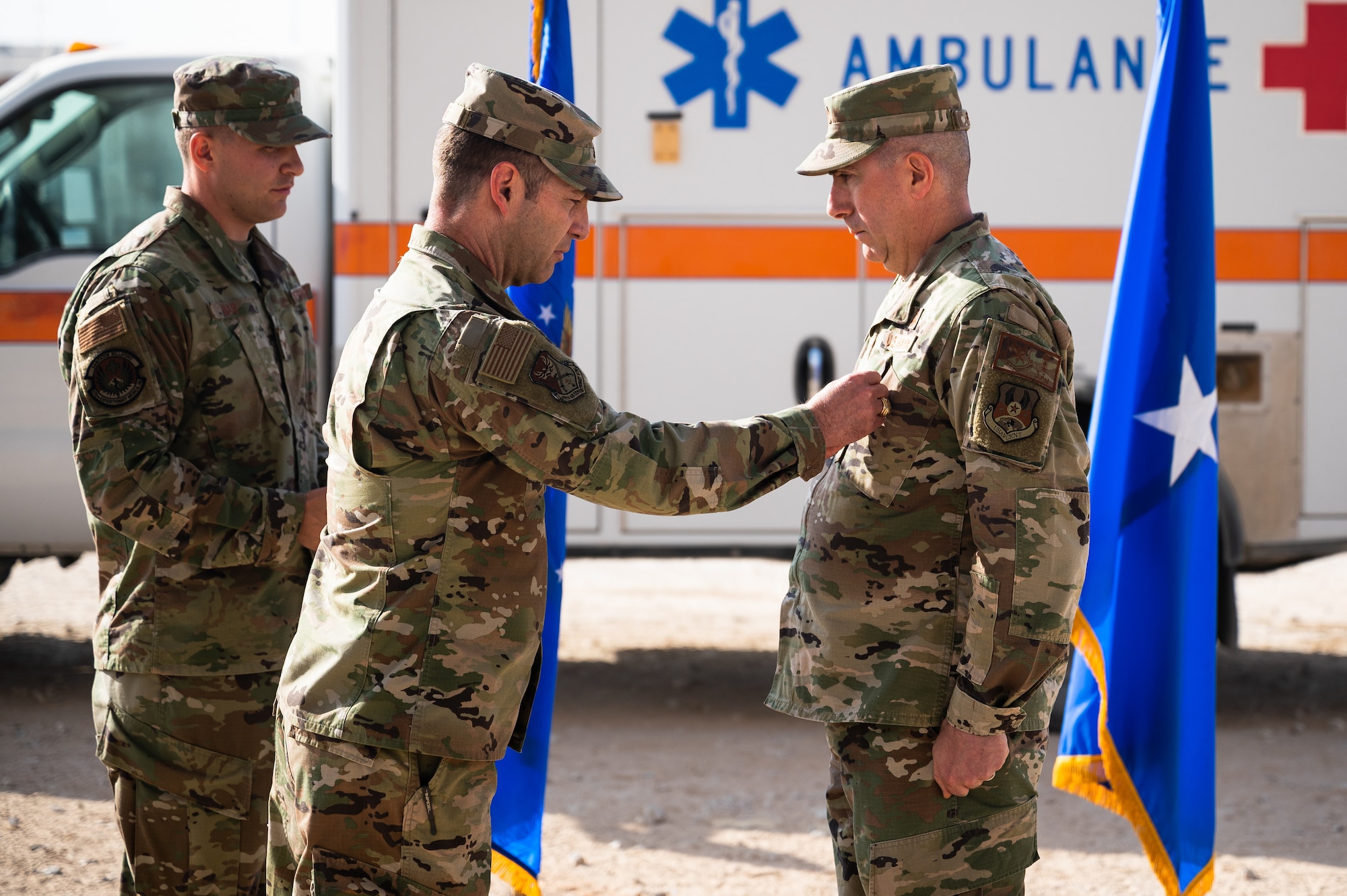 Col. Wayne Peters, right, outgoing 378th Expeditionary Medical Group commander, receives the Meritorious Service Medal from Brig. Gen. Robert Davis, left, 378th Air Expeditionary Wing commander, during the 378th EMDG change of command ceremony at Prince Sultan Air Base, Kingdom of Saudi Arabia, Nov. 9, 2021. The Meritorious Service Medal is awarded to members of the armed services who distinguish themselves by outstanding service to the United States. (U.S. Air Force photo by Senior Airman Jacob B. Wrightsman)