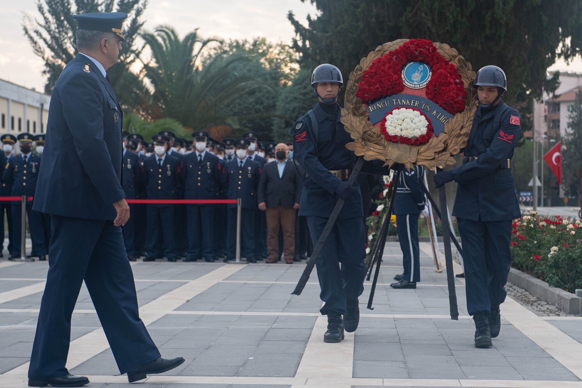 Turkish Air Force honor guardsmen carry a wreath during the Atatürk Memorial Day ceremony