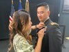 Oanh Pham pins Capt. Andrew Vu’s flight wings onto his dress uniform during the graduation ceremony from the Initial Entry Rotary Wing course at Fort Rucker, Alabama, on Nov. 4, 2021. Vu, with the Pennsylvania National Guard, was one of four honor graduate officers in the class (U.S. Army courtesy photo).