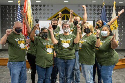 The U.S. Army Financial Management Command’s Army Financial Services Accounting Oversight and Operations team celebrates ‘surviving’ the U.S. Army’s year-end close at the Maj. Gen. Emmett J. Bean Federal Center in Indianapolis Oct. 1, 2021. Pictured from left to right are Brian Sayer, Jennifer Lashbrook, Melanie Jackson, Spence Powell, Kimberly Hood, Scott Ferge, Cynthia Price, Eddra Peoples and Joyce Dean. (U.S. Army photo by Mark R. W. Orders-Woempner)