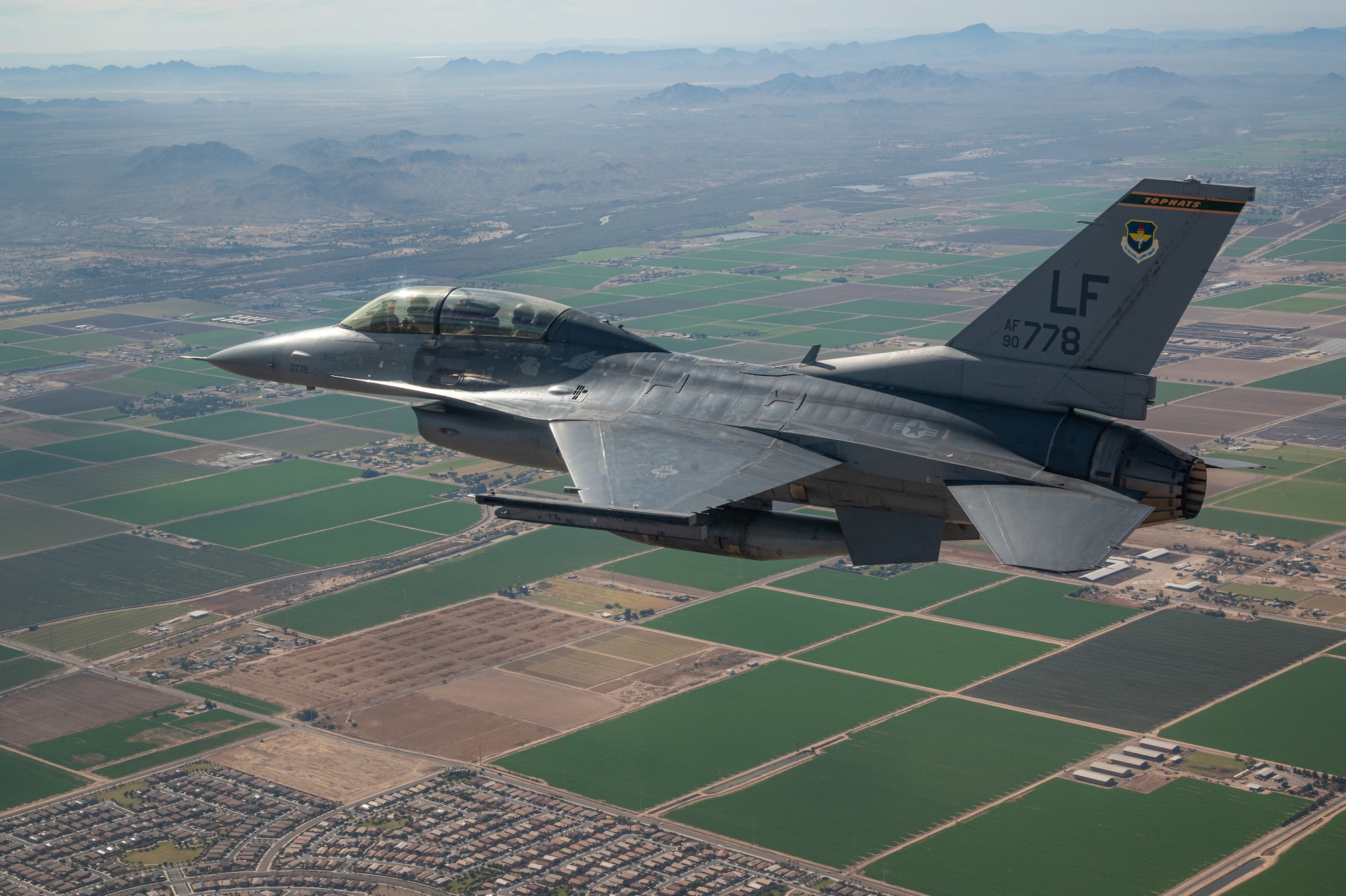 A U.S. Air Force F-16 Fighting Falcon assigned to the 56th Fighter Wing, Luke Air Force Base, Arizona, flies over Phoenix during the NASCAR Cup Series Championship Nov. 7, 2021.