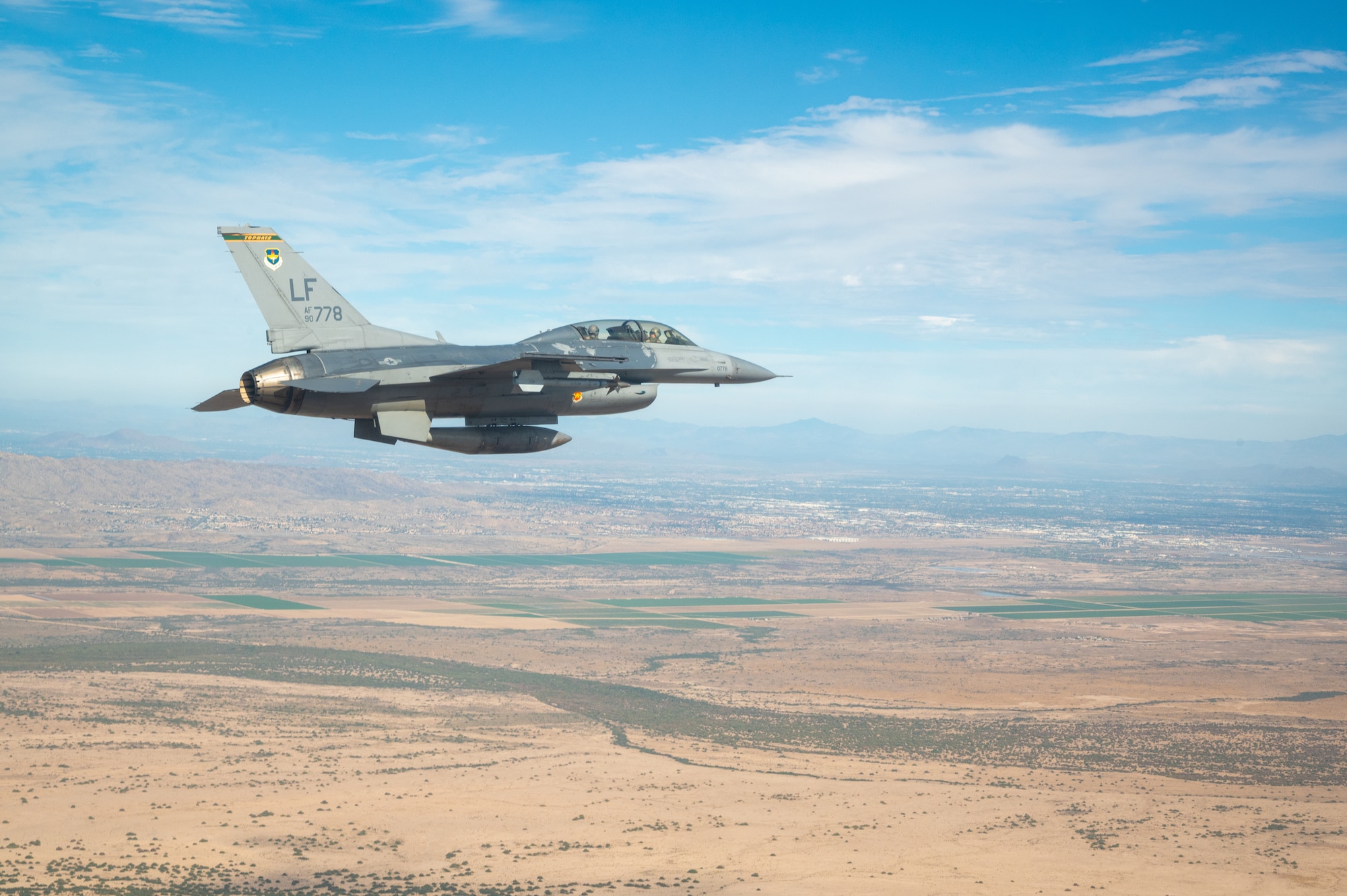 A U.S. Air Force F-16 Fighting Falcon assigned to the 56th Fighter Wing, Luke Air Force Base, Arizona, flies over Phoenix during the NASCAR Cup Series Championship Nov. 7, 2021.