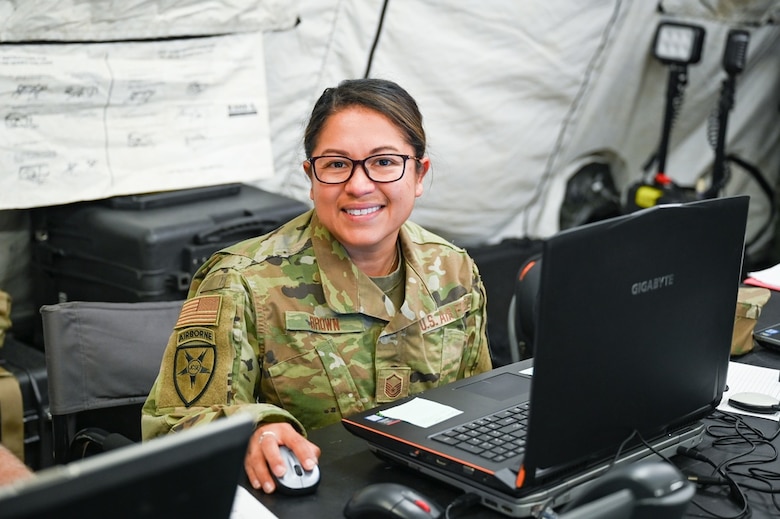 Master Sgt. Catherine Brown poses for a photo in her simulated deployed environment during Patriot 21 exercise