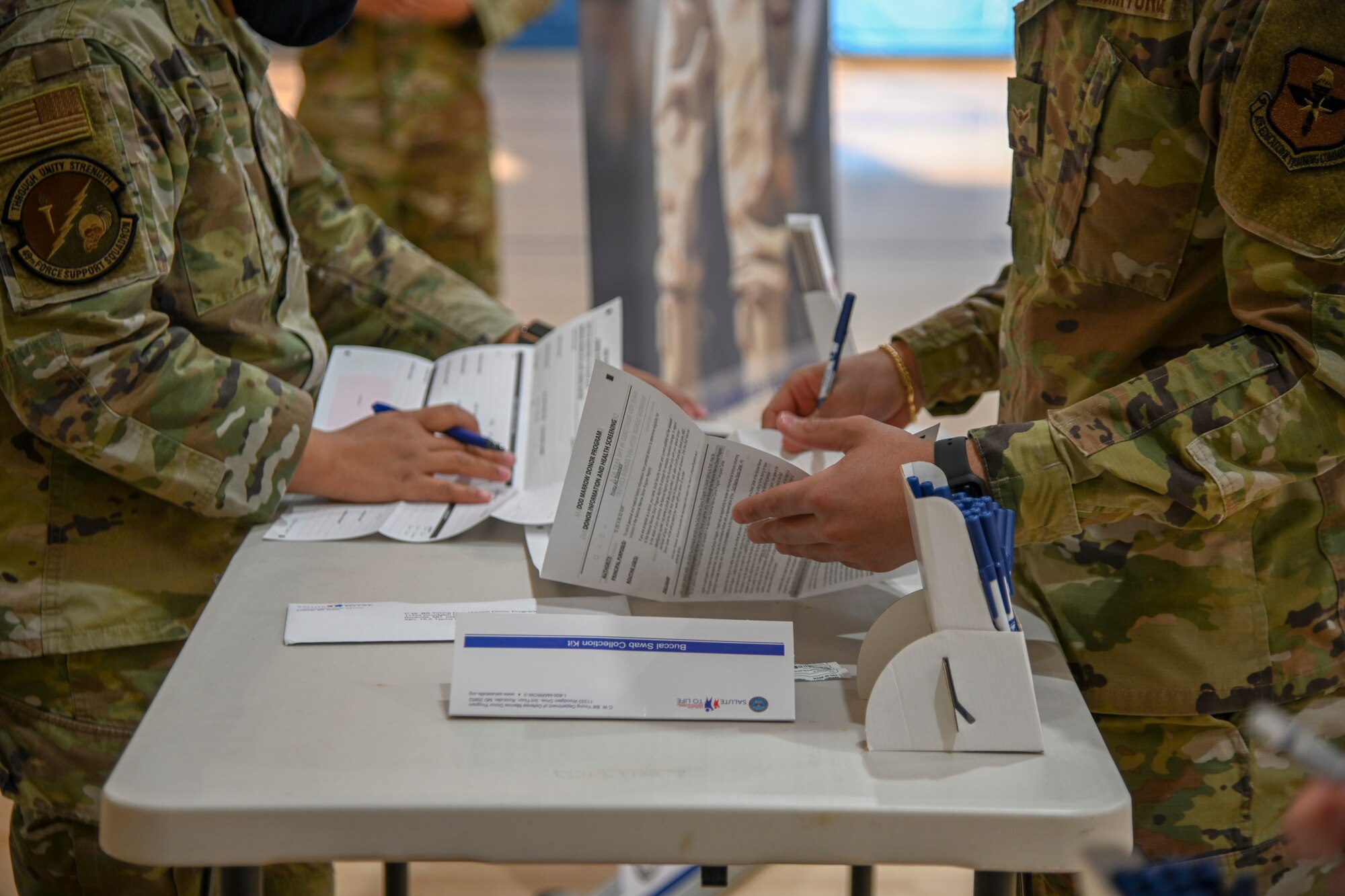 Members from the 49th Wing register to become bone marrow donors during a Salute to Life registration kick-off event, Nov. 15, 2021, on Holloman Air Force Base, New Mexico. All military personnel (Active Duty, Guard and Reserve), DoD civilians and their dependents aged 18-60 that are in good general health can register as marrow donors in just 10 minutes by completing a consent form, and swabbing the inside of their cheeks. (U.S. Air Force photo by Airman 1st Class Jessica Sanchez-Chen)