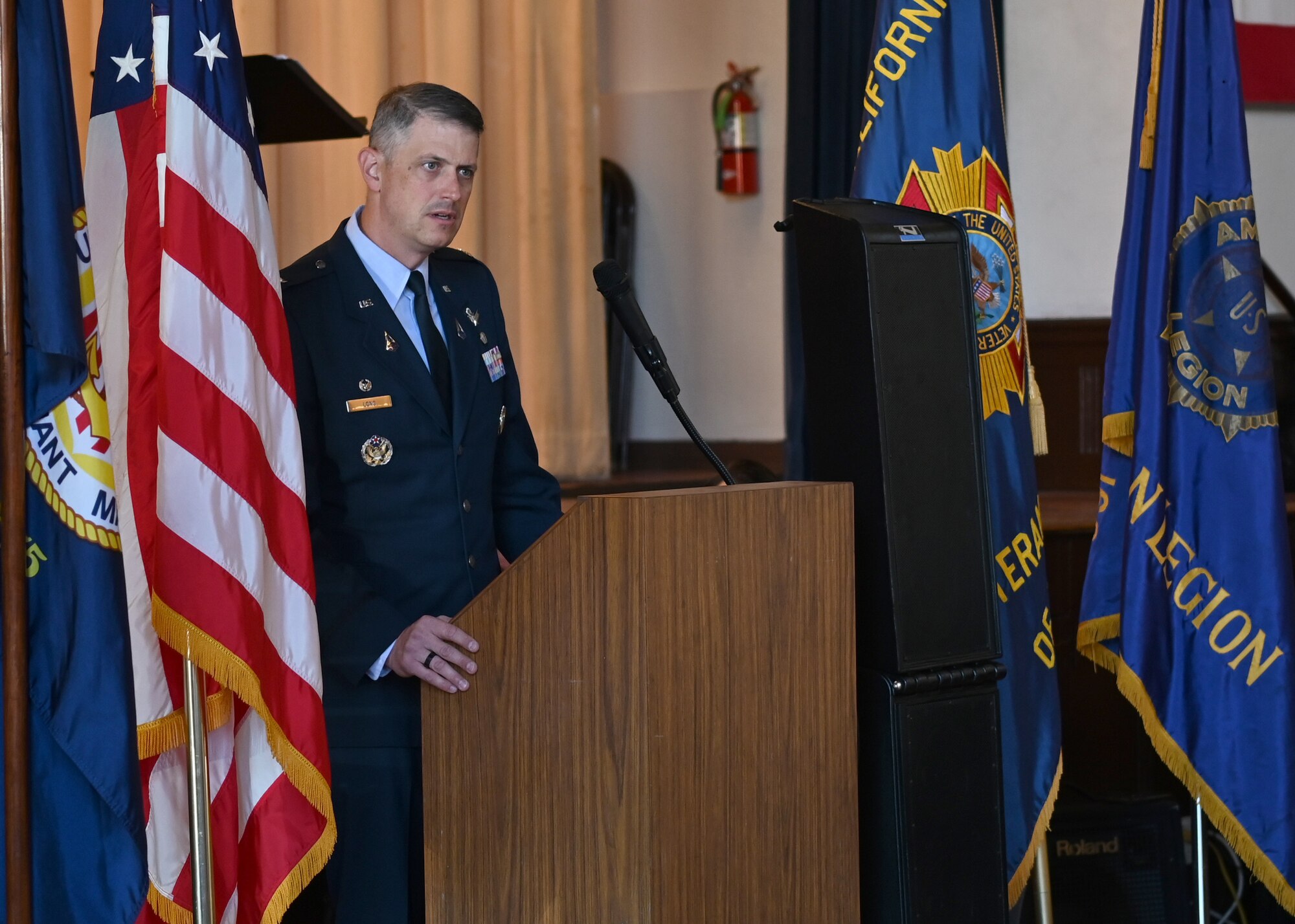 Man speaks at podium