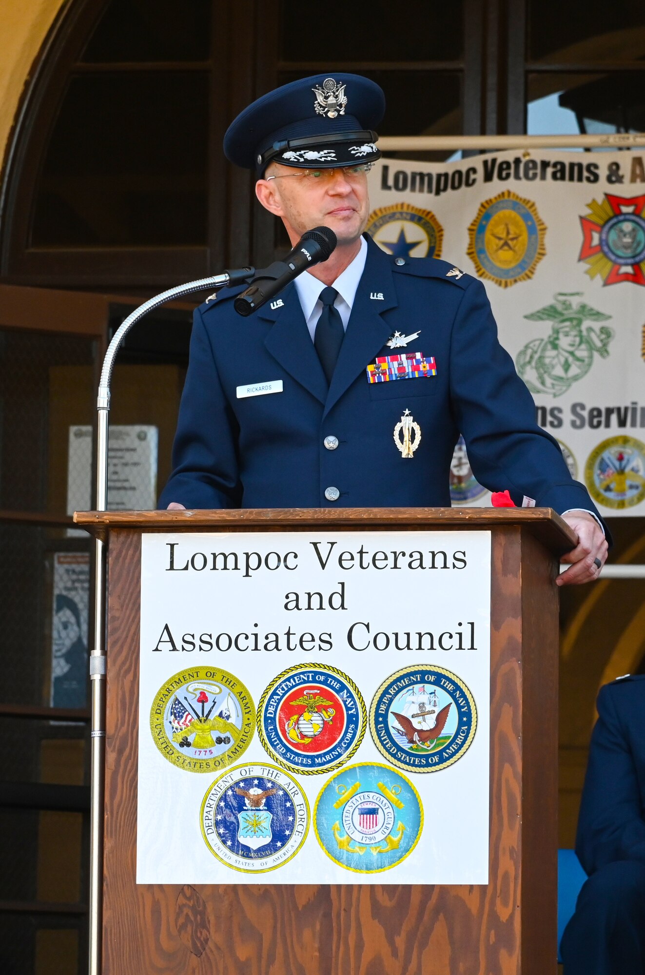 Man speaks at podium