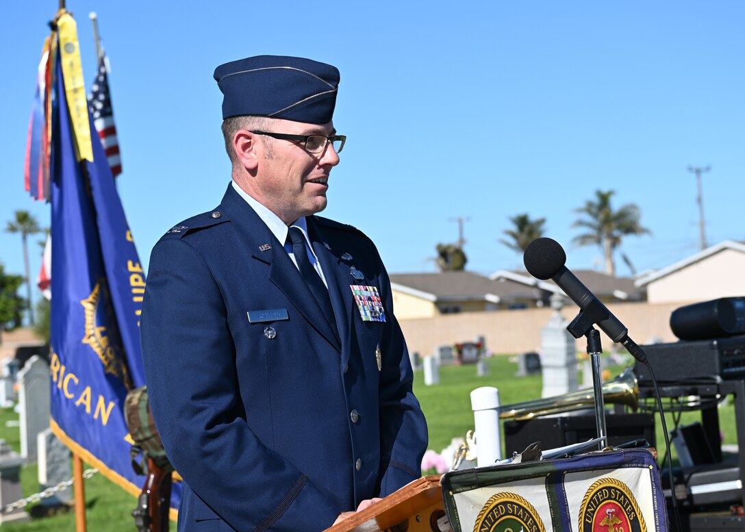 Man standing at podium in uniform