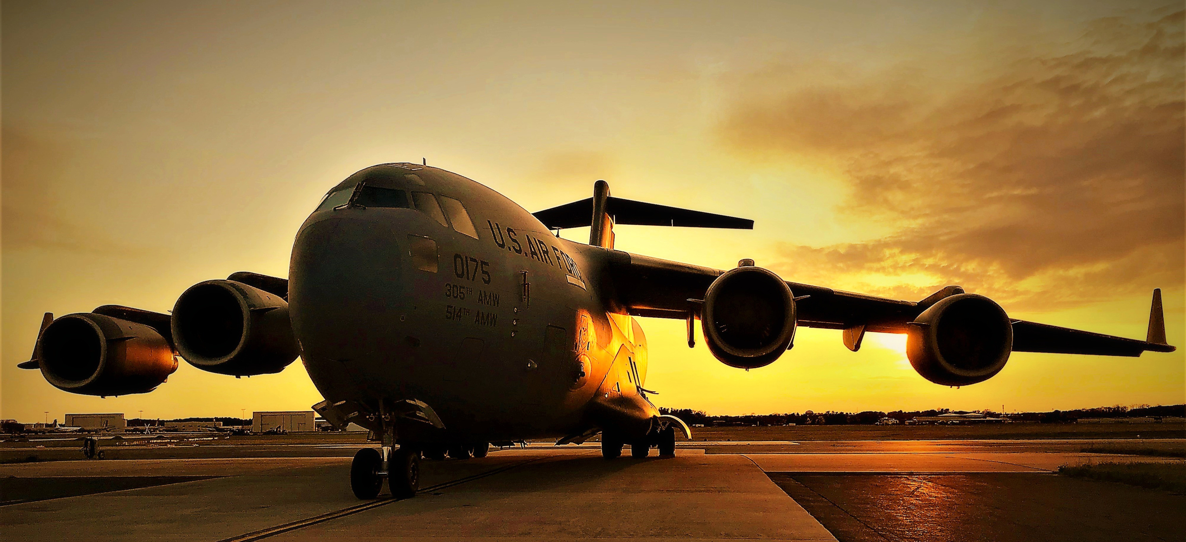 A C-17 Globemaster III assigned to the 305th Air Mobility Wing is parked on the flight line at Joint Base McGuire-Dix-Lakehurst, N.J., April 5, 2020. The C-17 can perform tactical airlift and airdrop missions and can transport litters and ambulatory patients during aeromedical evacuations. This image is a photo illustration, adjusted yellow levels. (U.S. Air Force photo illustration by Maj. Brian Wagner)