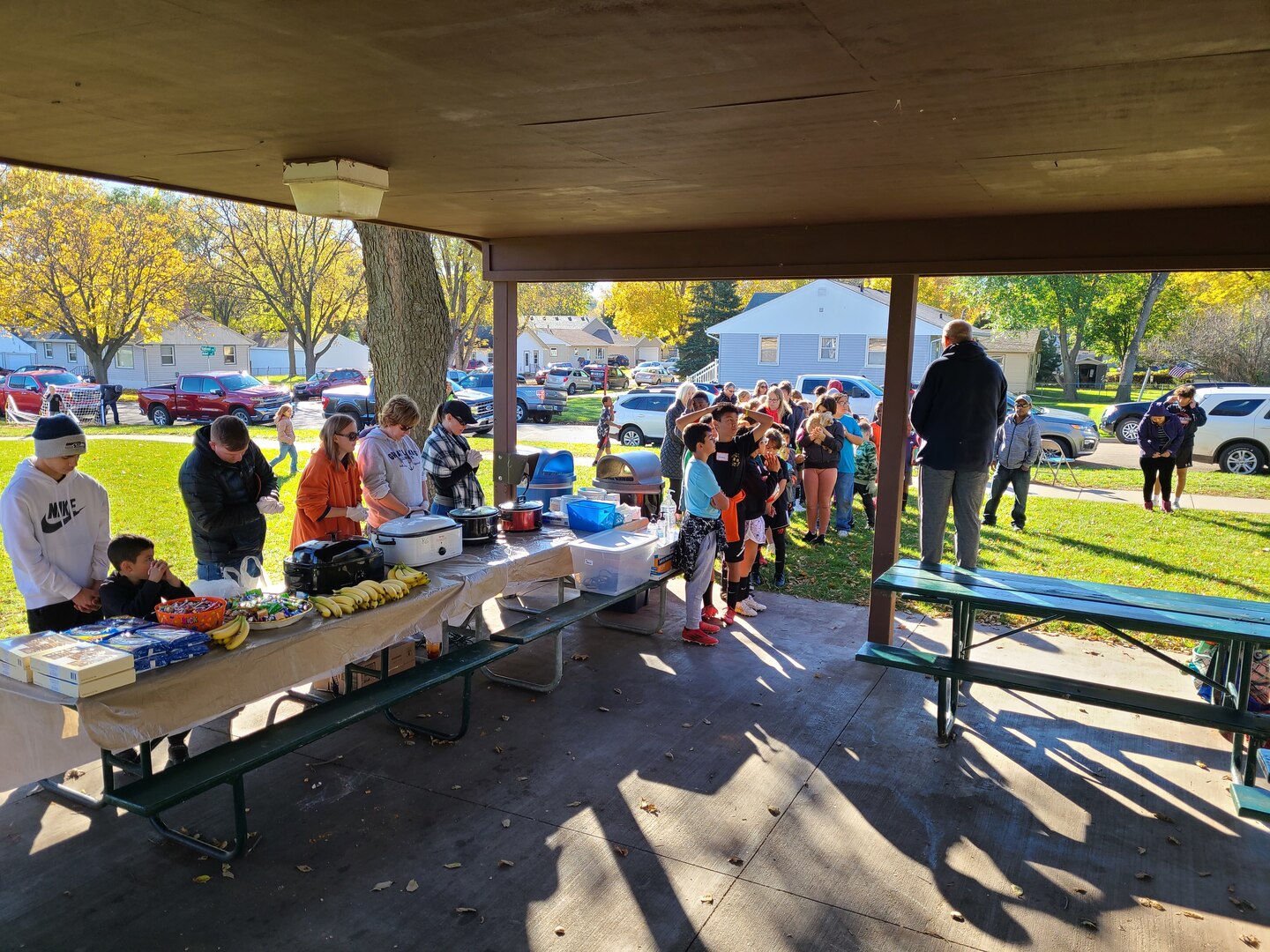 Volunteers, participants and their parents lined up for a hot lunch the last day of the soccer league Oct. 23.