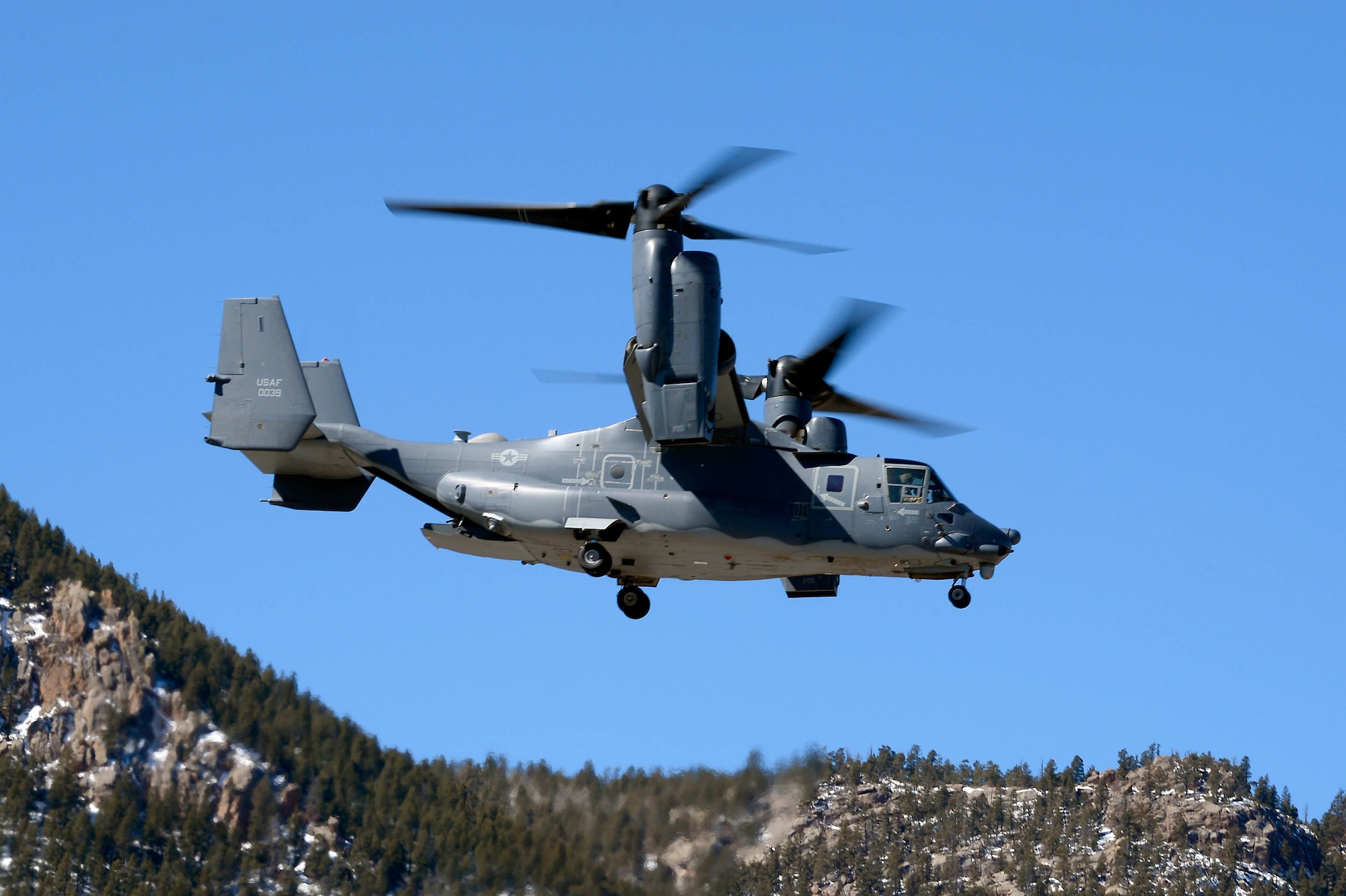 U.S. Air Force Academy - - A CV-22 Osprey flies over the terrazzo on March 20, 2019 during a demonstration to showcase the aircraft.  The Osprey landed on the terrazzo and cadets were able to speak with the crew and tour the aircraft. (U.S. Air Force photo/Darcie L. Ibidapo)