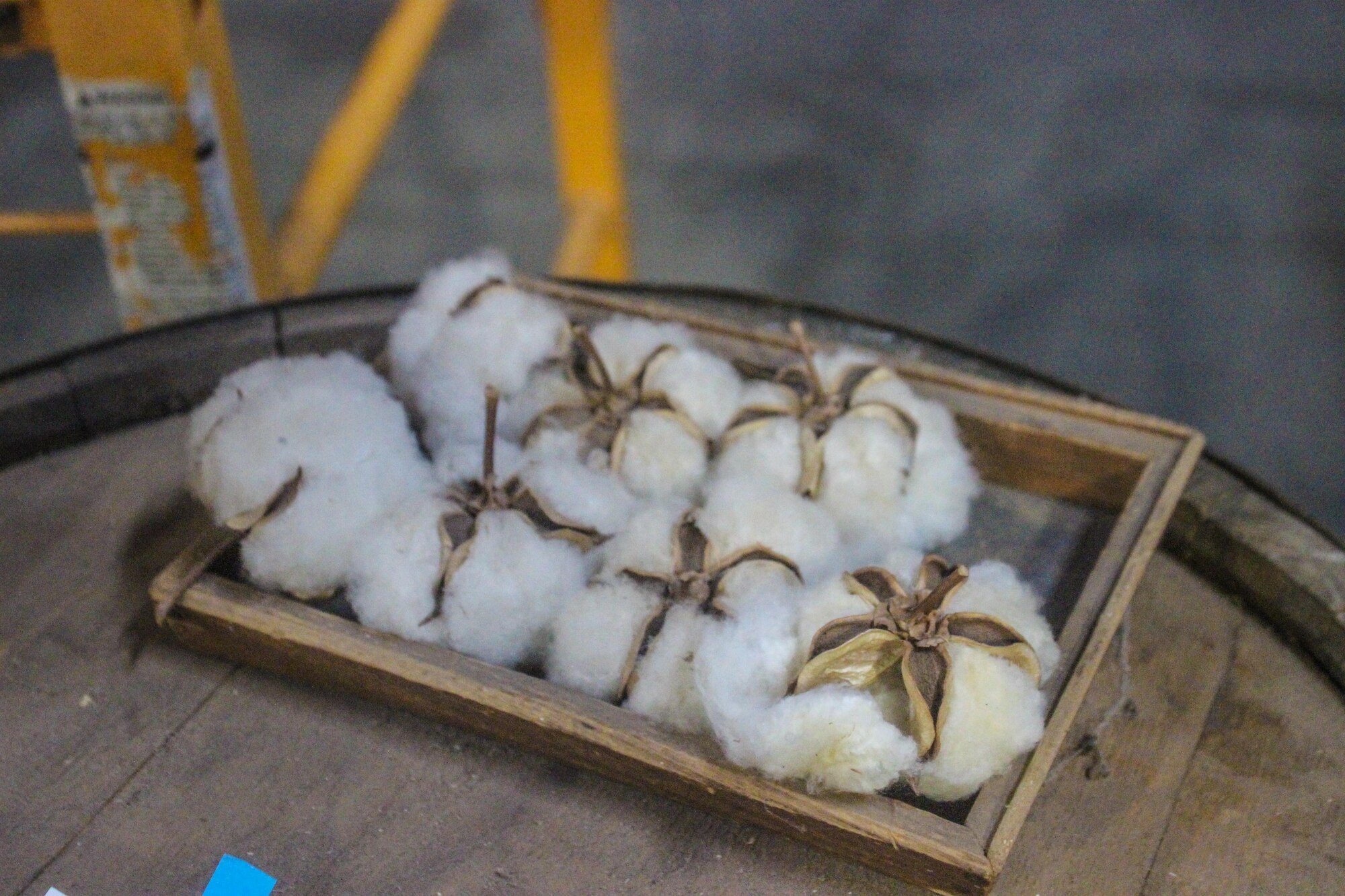 Cotton is in a wooden container