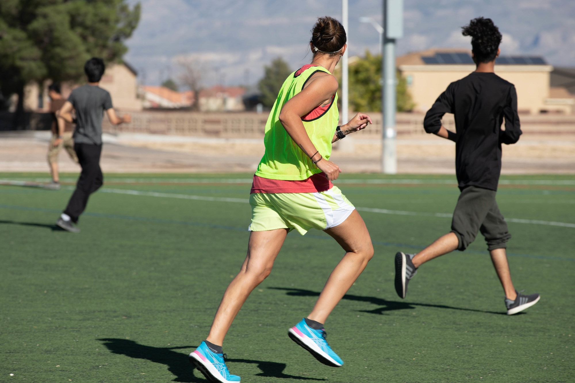 Service members assigned to Task Force Holloman compete in a soccer game against Afghan evacuees on Holloman Air Force Base, New Mexico, Oct. 24, 2021. The Department of Defense, through U.S. Northern Command, and in support of the Department of Homeland Security, is providing transportation, temporary housing, medical screening, and general support for at least 50,000 Afghan evacuees at suitable facilities, in permanent or temporary structures, as quickly as possible. This initiative provides Afghan personnel essential support at secure locations outside Afghanistan. (US Army photo by Pfc. Anthony Sanchez)