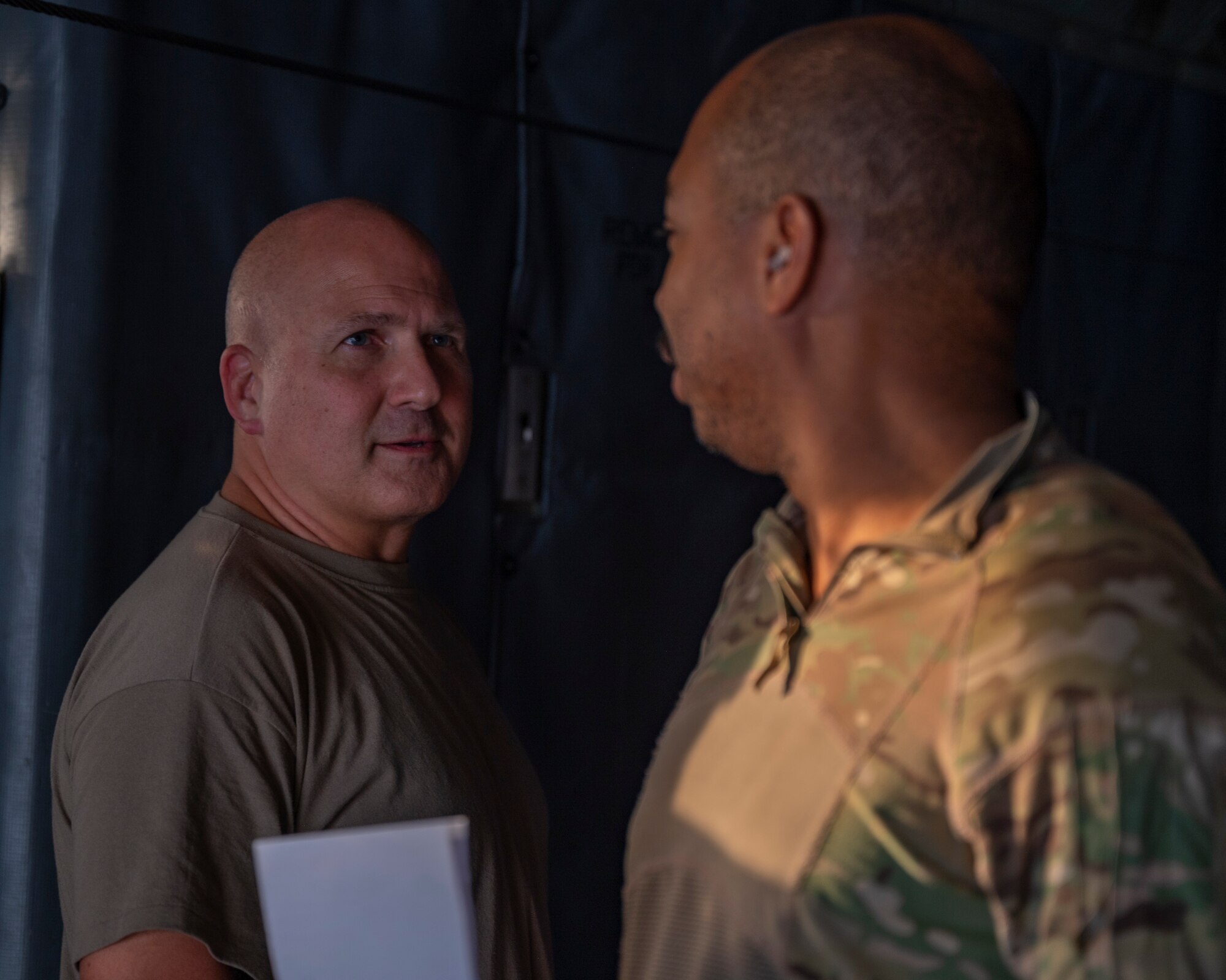 Members assigned to the 779th Expeditionary Airlift Squadron discuss cargo loading plans on a C-130H Hercules at Ali Al Salem Air Base, Kuwait, Oct. 31, 2021.