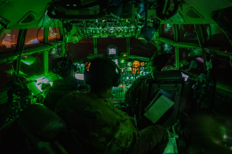 Crew members assigned to the 779th Expeditionary Airlift Squadron conduct flight operations on a C-130H Hercules above an undisclosed location in Southwest Asia, Oct. 31, 2021.