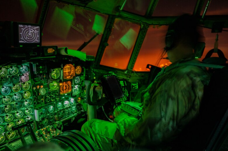 A copilot assigned to the 779th Expeditionary Airlift Squadron conduct flight operations on a C-130H Hercules above an undisclosed location in Southwest Asia, Oct. 31, 2021.