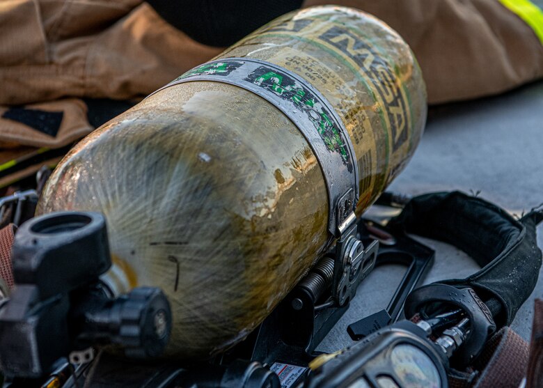 An oxygen tank lays on the ground at Patrick Space Force Base, Fla., Nov. 3, 2021. The tank, and others like it, were used by firefighters assigned to the 45th Civil Engineer Squadron at Patrick SFB to protect them while they battled a simulated aircraft fire at the base. Simulated aircraft fires are held annually to help firefighters maintain certifications and prepare for possible emergency situations. (U.S. Space Force photo by Airman 1st Class Dakota Raub)
