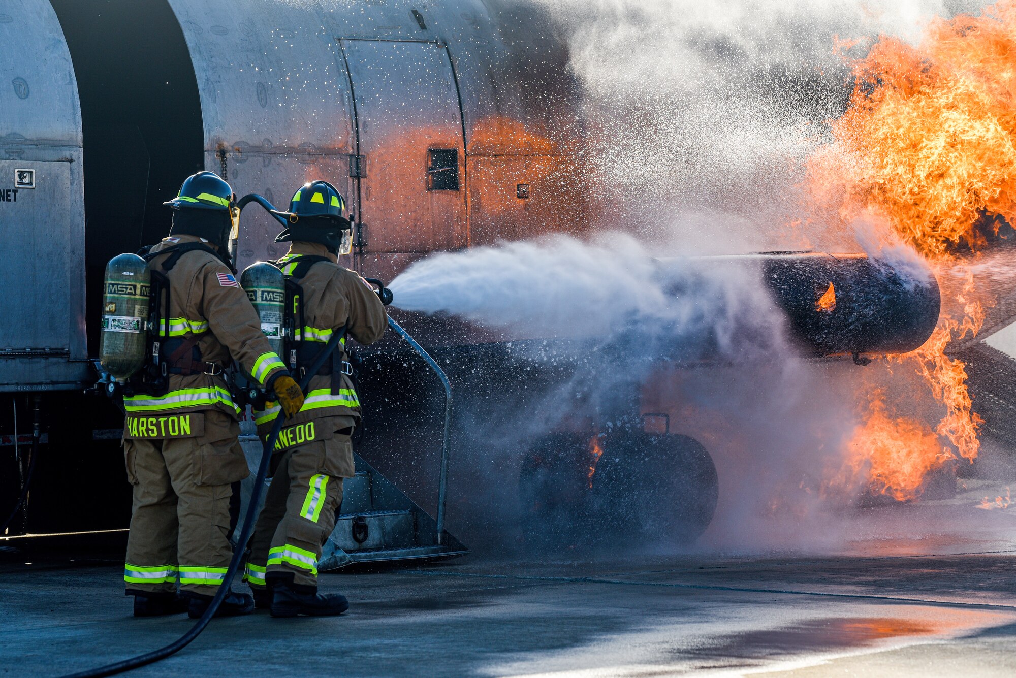 Firefighters assigned to the 45th Civil Engineer Squadron at Patrick Space Force Base, Fla., battle a simulated aircraft fire at Patrick SFB Nov. 3, 2021. Simulated aircraft fires are held annually to help firefighters maintain certifications and prepare for emergency situations. (U.S. Space Force photo by Airman 1st Class Dakota Raub)