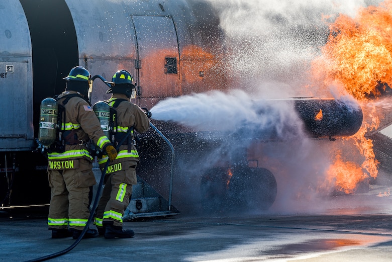 Firefighters assigned to the 45th Civil Engineer Squadron at Patrick Space Force Base, Fla., battle a simulated aircraft fire at Patrick SFB Nov. 3, 2021. Simulated aircraft fires are held annually to help firefighters maintain certifications and prepare for emergency situations. (U.S. Space Force photo by Airman 1st Class Dakota Raub)