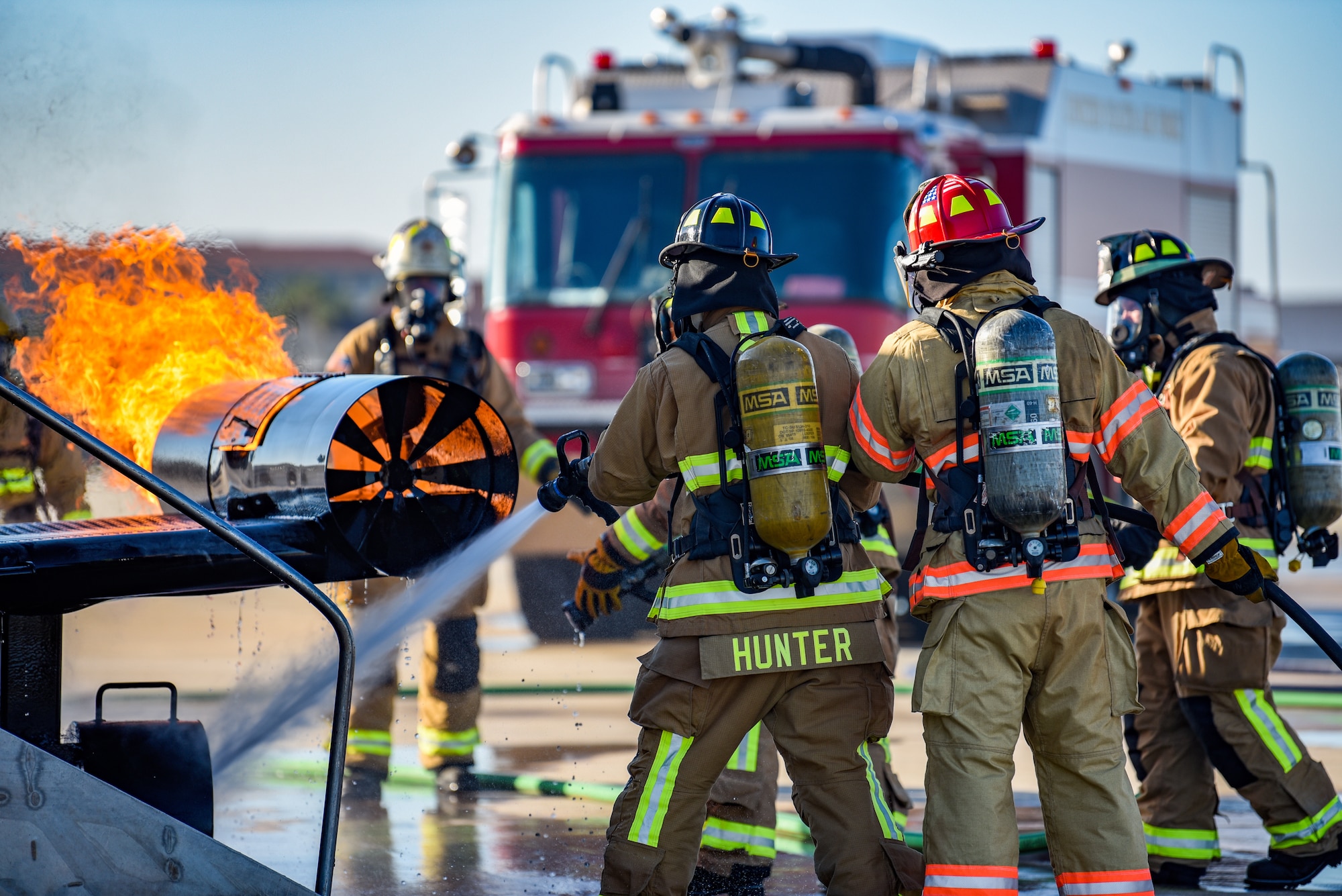 Firefighters assigned to the 60th Civil Engineer Squadron at Patrick Space Force Base, Fla., battle a simulated aircraft fire at Patrick SFB Nov. 3, 2021. Simulated aircraft fires are held annually to help firefighters maintain certifications and prepare for emergency situations. (U.S. Space Force photo by Airman 1st Class Dakota Raub)