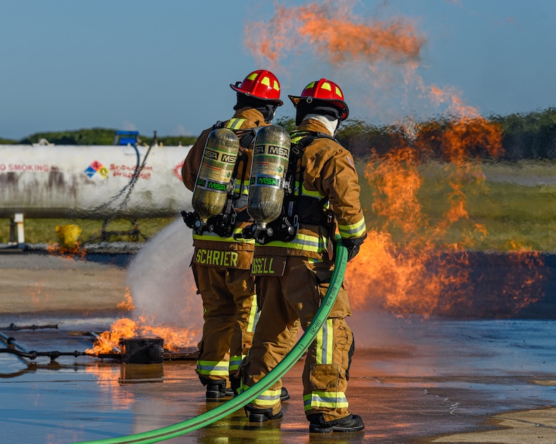 Firefighters assigned to the 60th Civil Engineer Squadron at Patrick Space Force Base, Fla., battle a simulated aircraft fire at Patrick SFB Nov. 3, 2021. Simulated aircraft fires are held annually to help firefighters maintain certifications and prepare for emergency situations. (U.S. Space Force photo by Airman 1st Class Dakota Raub)