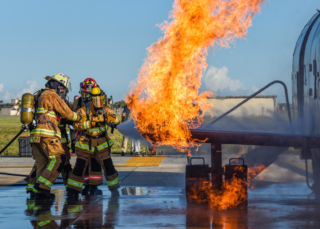 Firefighters assigned to the 45th Civil Engineer Squadron at Patrick Space Force Base, Fla., battle a simulated aircraft fire at Patrick SFB Nov. 3, 2021. Simulated aircraft fires are held annually to help firefighters maintain certifications and prepare for emergency situations. (U.S. Space Force photo by Airman 1st Class Dakota Raub)