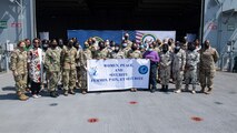 211115-N-LK647-0158 
DJIBOUTI CITY, Djibouti (Nov. 15, 2021) Participants of a Women, Peace, and Security conference held aboard the Expeditionary Sea Base USS Hershel "Woody" Williams (ESB 4) pose for a photo, Nov. 15, 2021. Hershel "Woody" Williams is on a scheduled deployment in the U.S. Sixth Fleet area of operations in support of U.S. national security interests in Europe and Africa. (U.S. Navy photo by Mass Communication Specialist 3rd Class Malachi Lakey/Released)