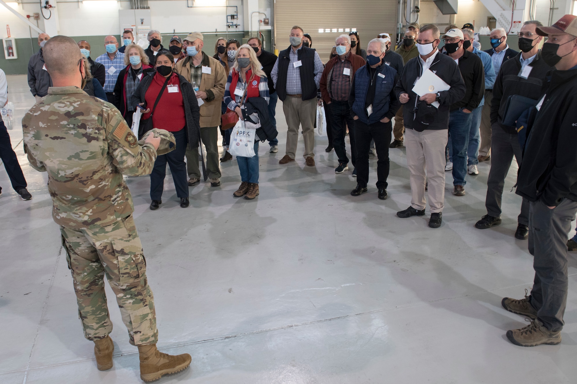 U.S. Air Force Maj. Jon Alexander, 167th Maintenance Squadron commander, responds to questions from participants of the Employer Support of the Guard and Reserve Bosslift event at the 167th Airlift Wing, Martinsburg, West Virginia, Nov. 9, 2021. Nearly 50 employers spent the day at the unit, where they learned about the unit’s mission as well as the mission of the ESGR. (U.S. Air National Guard photo by Senior Master Sgt. Emily Beightol-Deyerle)