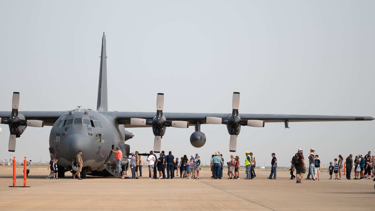 Airshow attendees take a tour through a U.S. Air Force AC-130W Stinger II from the 27th Special Operations Wing, Cannon Air Force Base, N.M., during High Sky Wing Commemorative Air Force AIRSHO 2021, at Midland International Air and Space Port, Midland, Texas, Sept. 11, 2021. The Air Force was featured at AIRSHO and showcased multiple aircraft in its inventory to include the AC-130W, MC-130J and the A-10 Thunderbolt II, displaying capabilities of airpower through aerial demonstrations and/or static displays. (U.S. Air Force photo by Staff Sgt. Peter Reft)