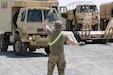 U.S. Soldiers with the 28th Expeditionary Combat Aviation Brigade and 40th Combat Aviation Brigade receive trucks and other equipment belonging to the 40th CAB as they arrive in the Middle East.
