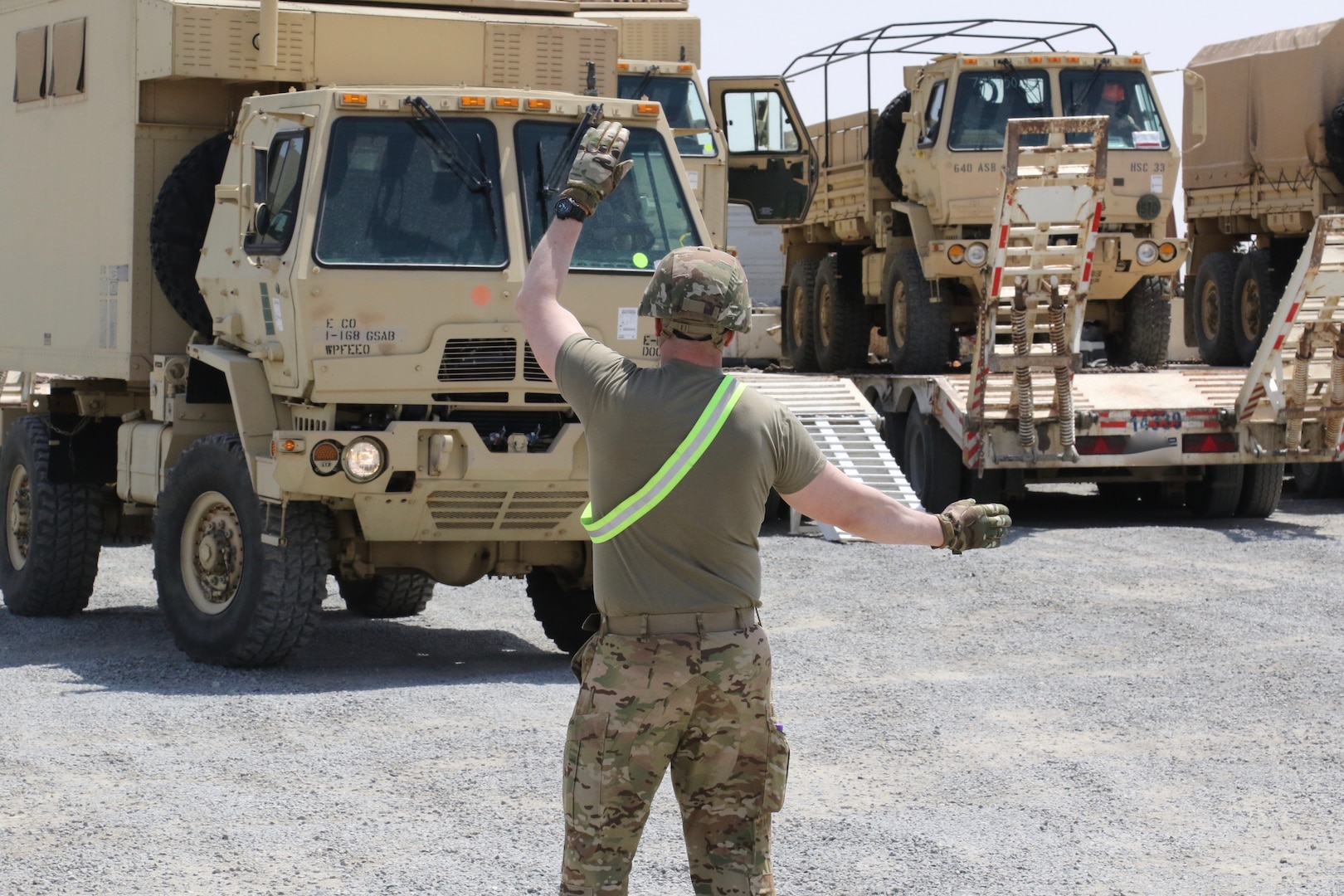 U.S. Soldiers with the 28th Expeditionary Combat Aviation Brigade and 40th Combat Aviation Brigade receive trucks and other equipment belonging to the 40th CAB as they arrive in the Middle East.