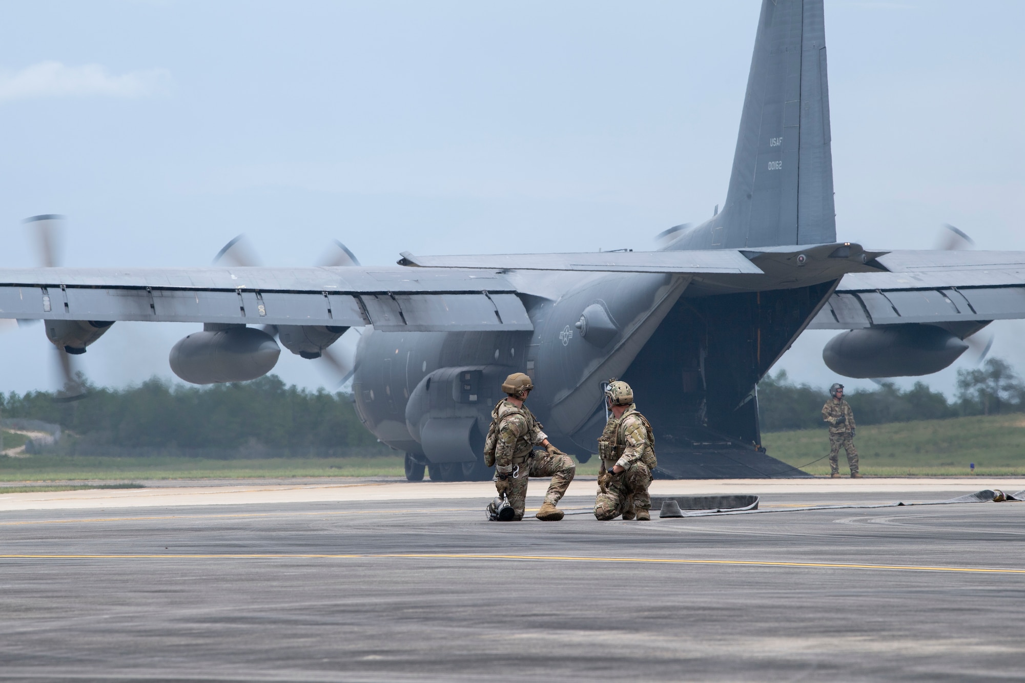 Airmen await the arrival of a F-35B Lightning II before demonstrating a forward arming and refueling point, or FARP, at Duke Field, Florida, July 21, 2021. The Airmen belong to Special Operations Command which is currently investing in key technologies to create innovative solutions for the joint force and dilemmas for adversaries. (U.S. Air Force photo by Staff Sgt. Janiqua P. Robinson)