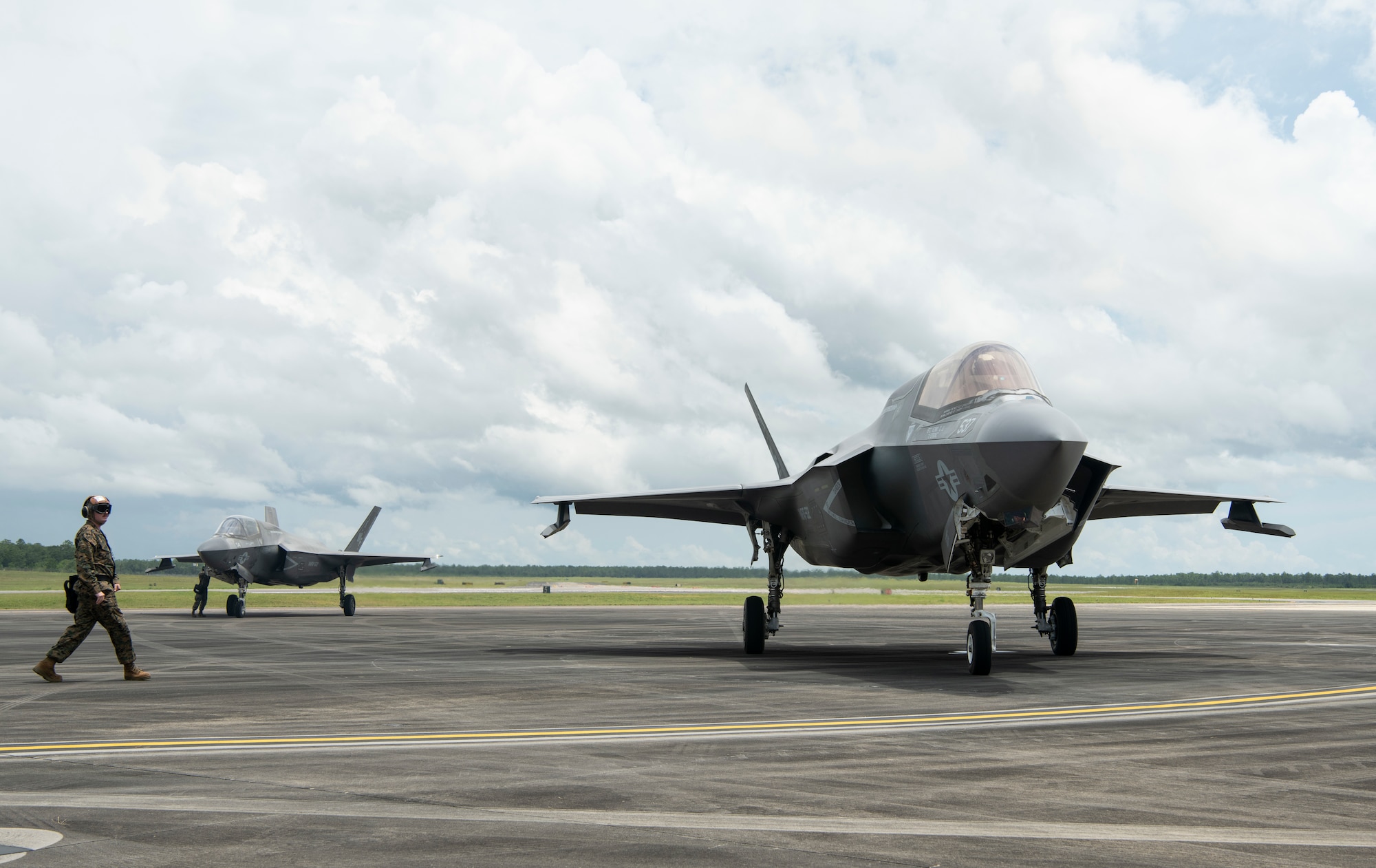 A U.S. Marine marshals in an F-35B Lightning II after a forward arming and refueling point, or FARP, demonstration at Duke Field, Florida, July 21, 2021. Capabilities like FARP ensure Airmen have multiple tools to accomplish a refueling mission in any environment, no matter how austere. (U.S. Air Force photo by Staff Sgt. Janiqua P. Robinson)