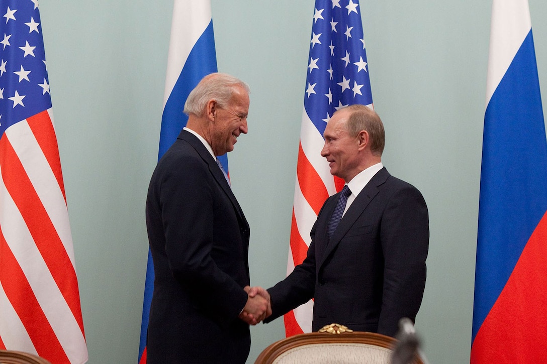 Then-US vice-president Joe Biden shakes hands with then-Russian prime minister Vladimir Putin during their meeting in Moscow on March 10, 2011.