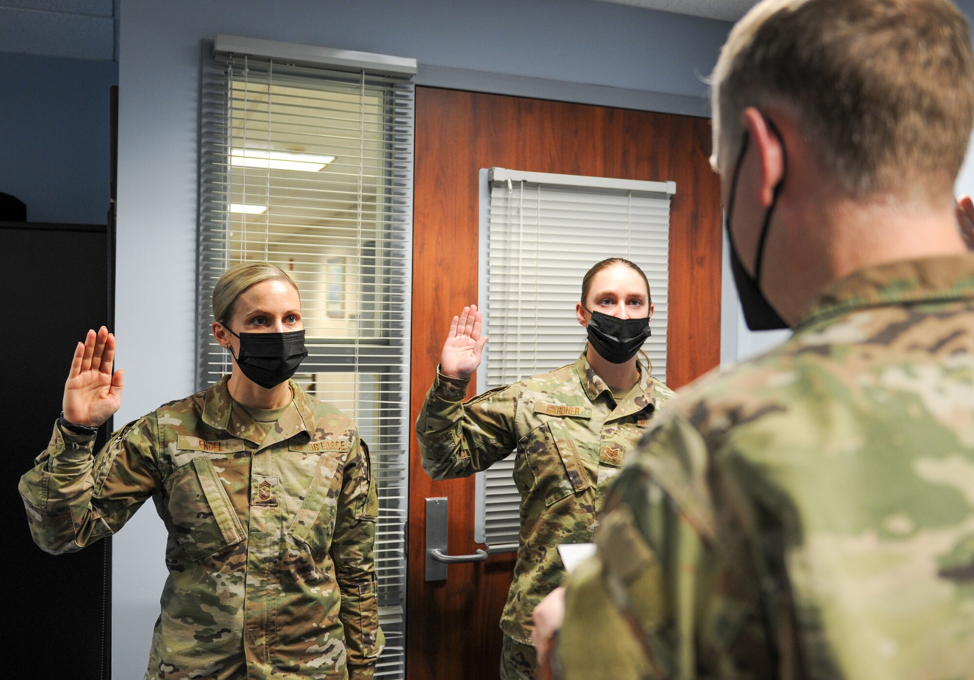 Airmen raise their right hands.