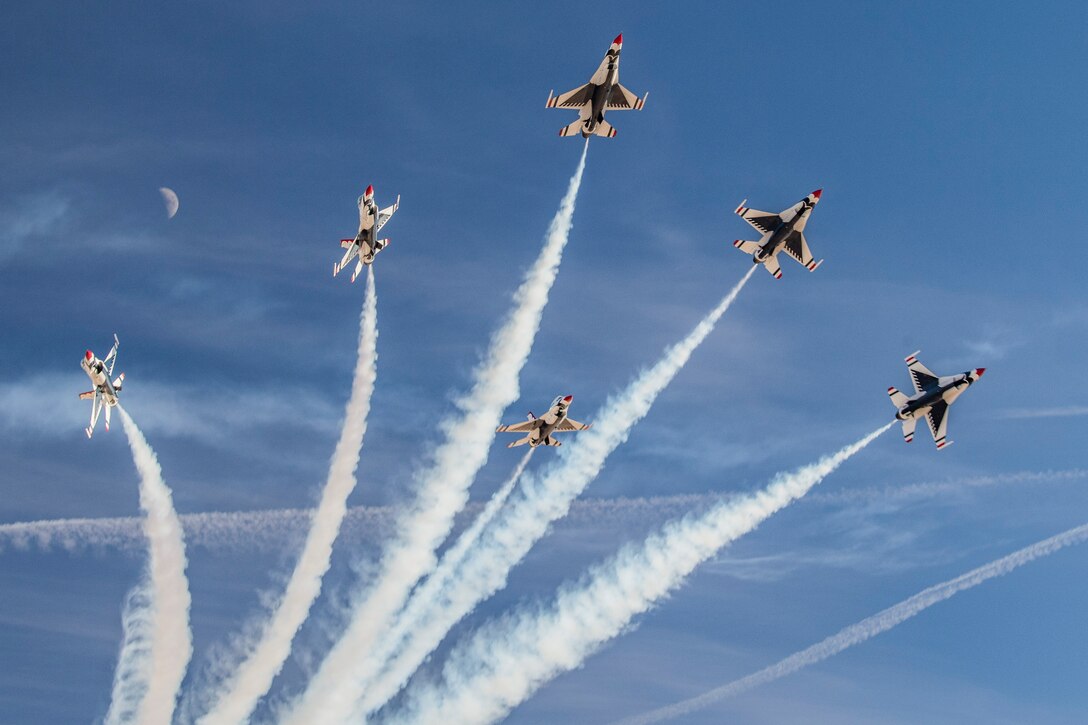 A group of aircraft fly in formation.