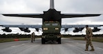 A U.S. Air Force loadmaster with the 352d Special Operations Wing guides a U.S. Army Soldier with 1st Battalion, 121st Field Artillery Regiment, while off-loading an M142 High Mobility Artillery Rocket System during a bilateral exercise at a highway landing zone in Gotland, Sweden, Oct. 23, 2021. This bilateral demonstration underscores, for the first time, the ability of Swedish and U.S. Forces to quickly employ long-range precision fires across the theater in a time and place of our choosing, while developing the ability to employ flexible capabilities with partners and allies in the Baltic Sea region.