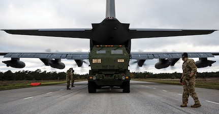 A U.S. Air Force loadmaster with the 352d Special Operations Wing guides a U.S. Army Soldier with 1st Battalion, 121st Field Artillery Regiment, while off-loading an M142 High Mobility Artillery Rocket System during a bilateral exercise at a highway landing zone in Gotland, Sweden, Oct. 23, 2021. This bilateral demonstration underscores, for the first time, the ability of Swedish and U.S. Forces to quickly employ long-range precision fires across the theater in a time and place of our choosing, while developing the ability to employ flexible capabilities with partners and allies in the Baltic Sea region.