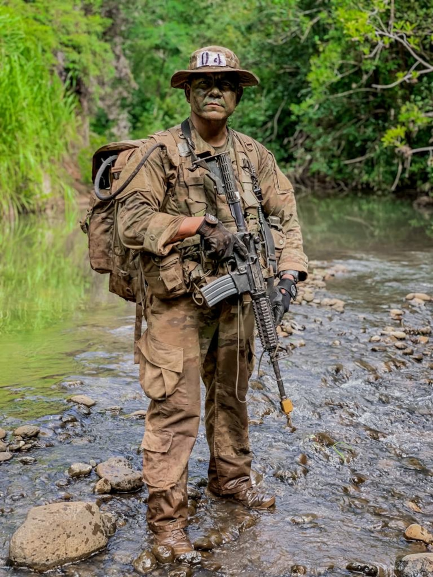 NCO stands in Hawaiian river bed