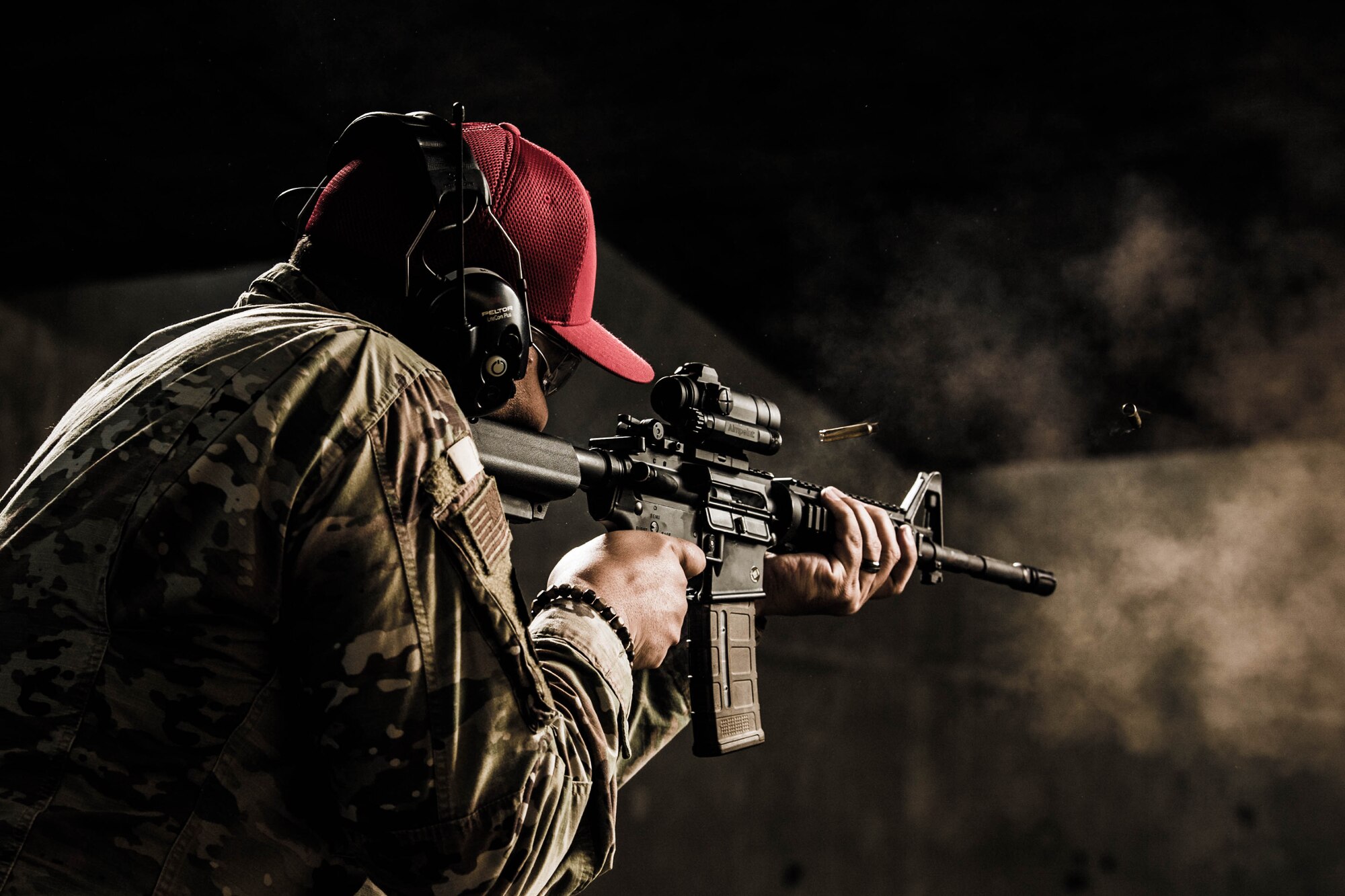 Staff Sgt. Jose Bracero-Camareno, 436th Security Forces Squadron combat arms instructor, fires an M4 carbine Nov. 8, 2021, at Dover Air Force Base, Delaware. The M4 is one of 10 weapons systems fired at the Dover AFB Combat Arms Training and Maintenance facility. (U.S. Air Force photo by Mauricio Campino)