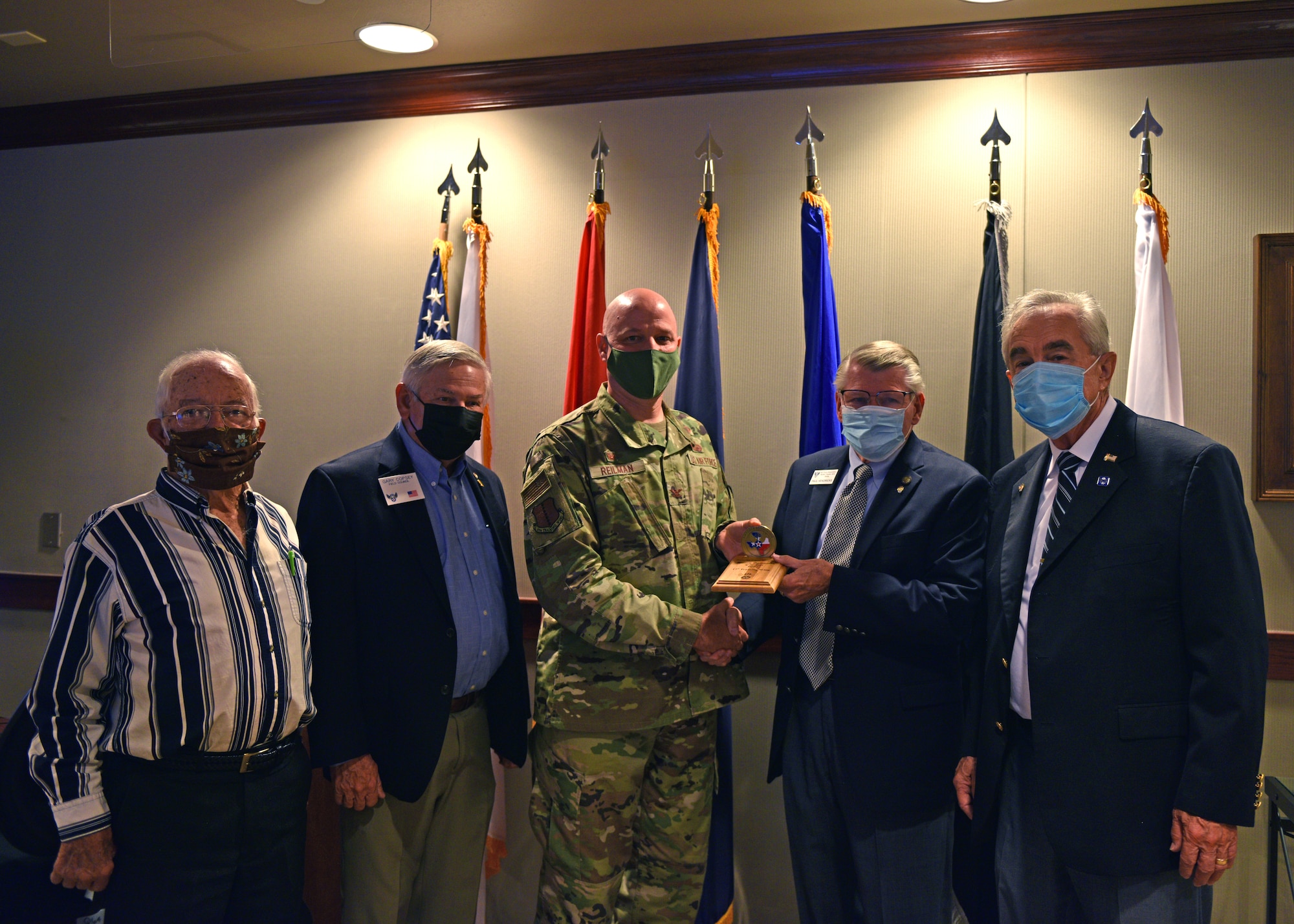 U.S. Air Force Col. Matthew Reilman, 17th Training Wing commander, and Texas Air Force Association representatives pose for a photo during a wing staff meeting on Goodfellow Air Force Base, Texas, Nov. 9, 2021. The 17th TRW was recognized as Military Organization of the Year for 2021. (U.S. Air Force photo by Senior Airman Ashley Thrash)