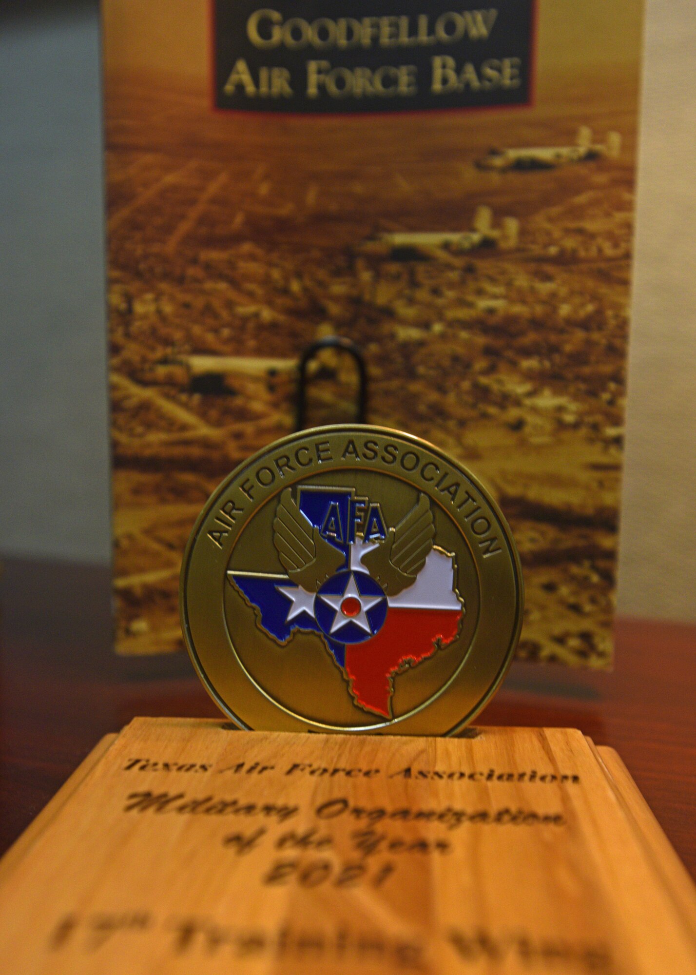 The Texas Air Force Association award and coin display at the Norma Brown building on Goodfellow Air Force Base, Texas, Nov. 9, 2021. Members from the Texas AFA recognized the 17th Training Wing with the award during a wing staff meeting. (U.S. Air Force photo by Senior Airman Ashley Thrash)