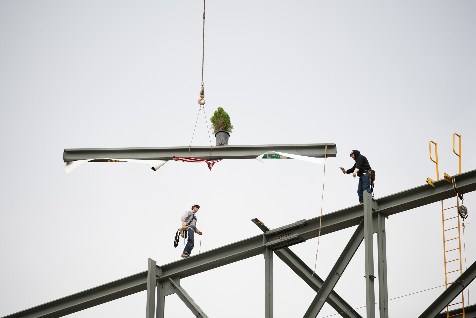construction workers attend topping out ceremony