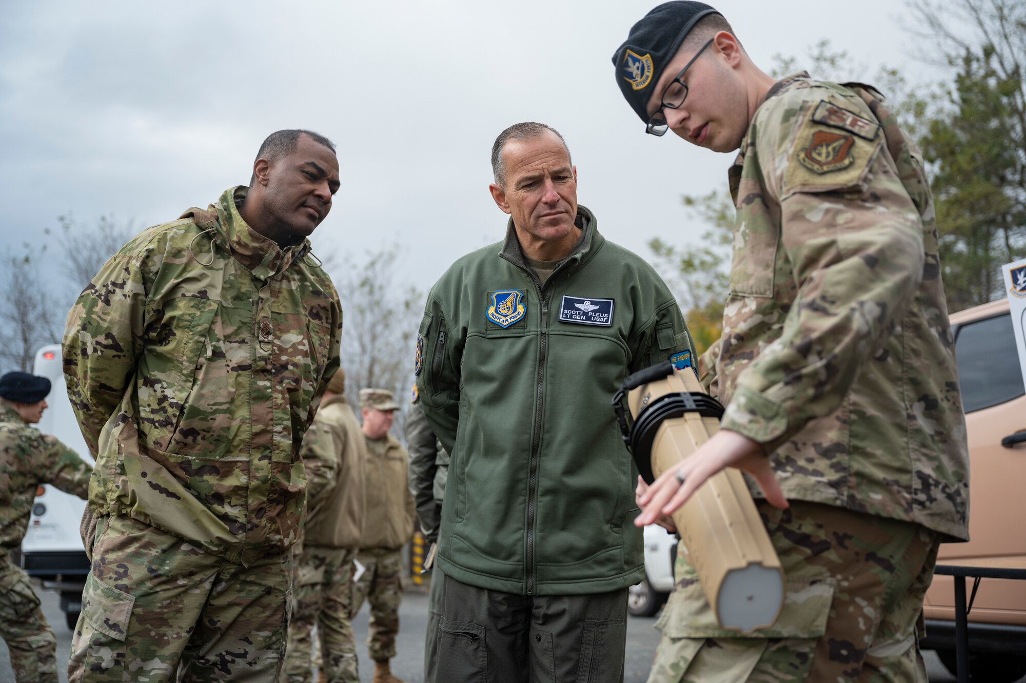 Airman First Class Alexander Rowe, 8th Security Forces Squadron response force member, briefs the counter small unmanned aircraft systems capabilities to Lt. Gen. Scott Pleus, Seventh Air Force commander, and Chief Master Sgt. Alvin Dyer, Seventh Air Force command chief, at Kunsan Air Base, Republic of Korea, Nov. 10, 2021.