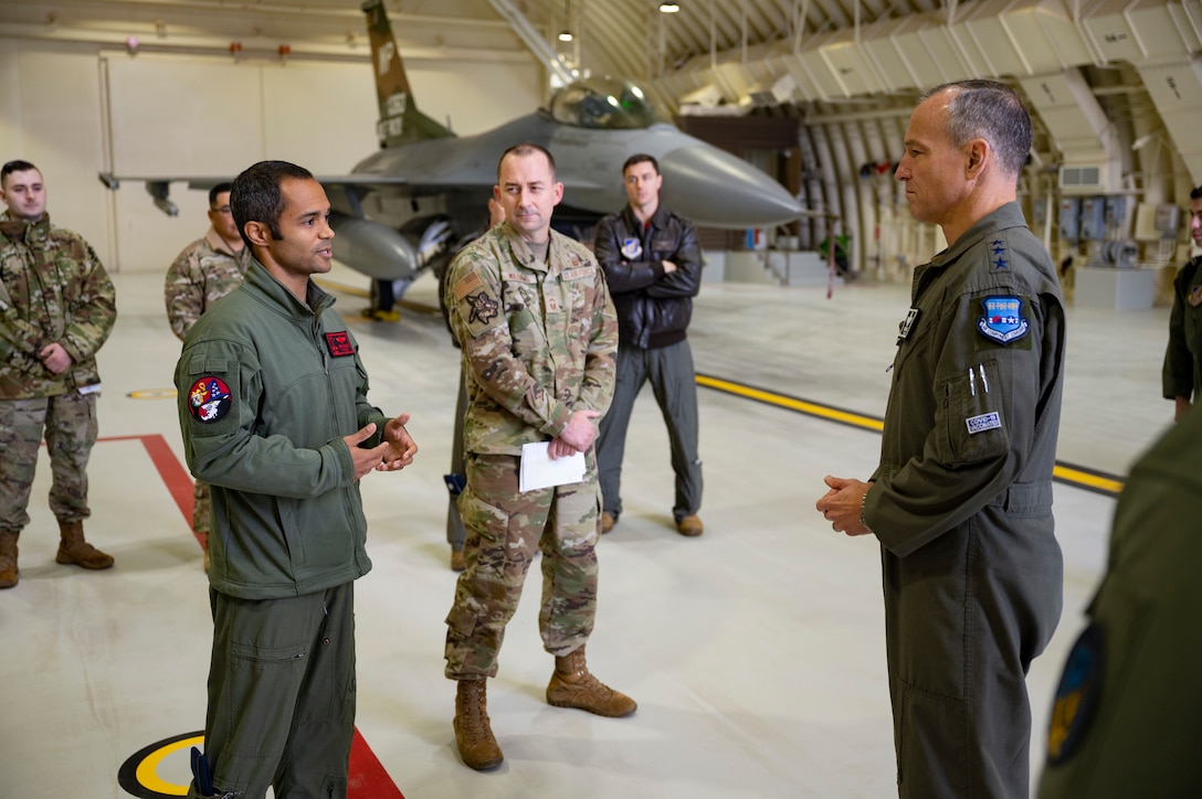 Maj. Michael Walker, 8th Fighter Wing intelligence officer, and Senior Master Sgt. John Williams, 8th Aircraft Maintenance Squadron assistant superintendent, brief the operational plan and future use of Kunsan’s third generation hardened aircraft shelters to Lt. Gen. Scott Pleus, Seventh Air Force commander, at Kunsan Air Base, Republic of Korea, Nov. 10, 2021.